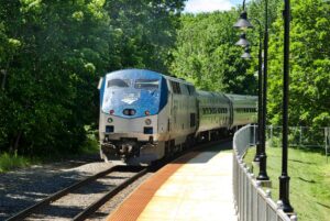 Amtrak train passing through the suburbs